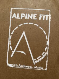 Screenprinted logo on the Alpine Fit apparel packaging