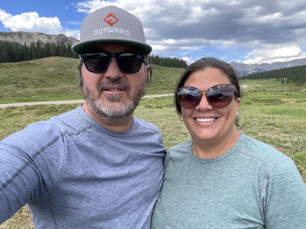 A man and a woman wearing their Alpine Fit Long Sleeve Base Layers while camping in Southwestern Colorado.