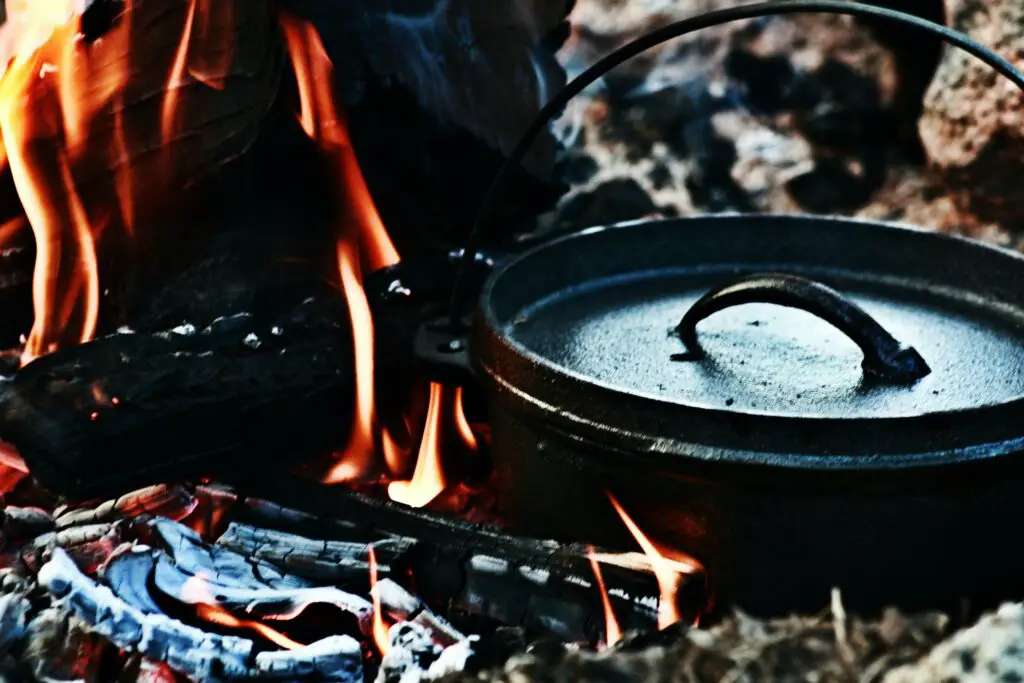 Cast iron camp oven over a campfire